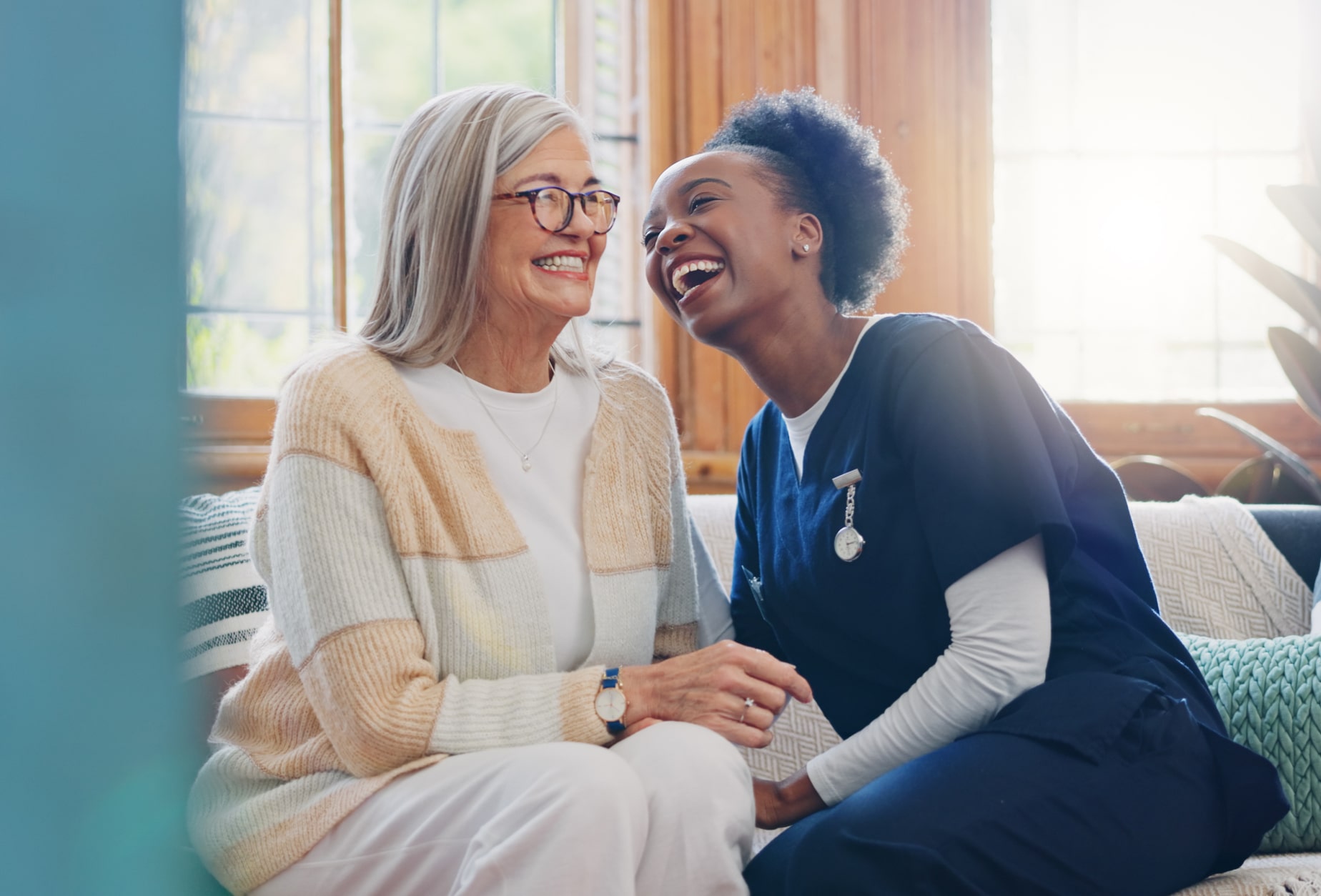 Nurse laughing with a patient