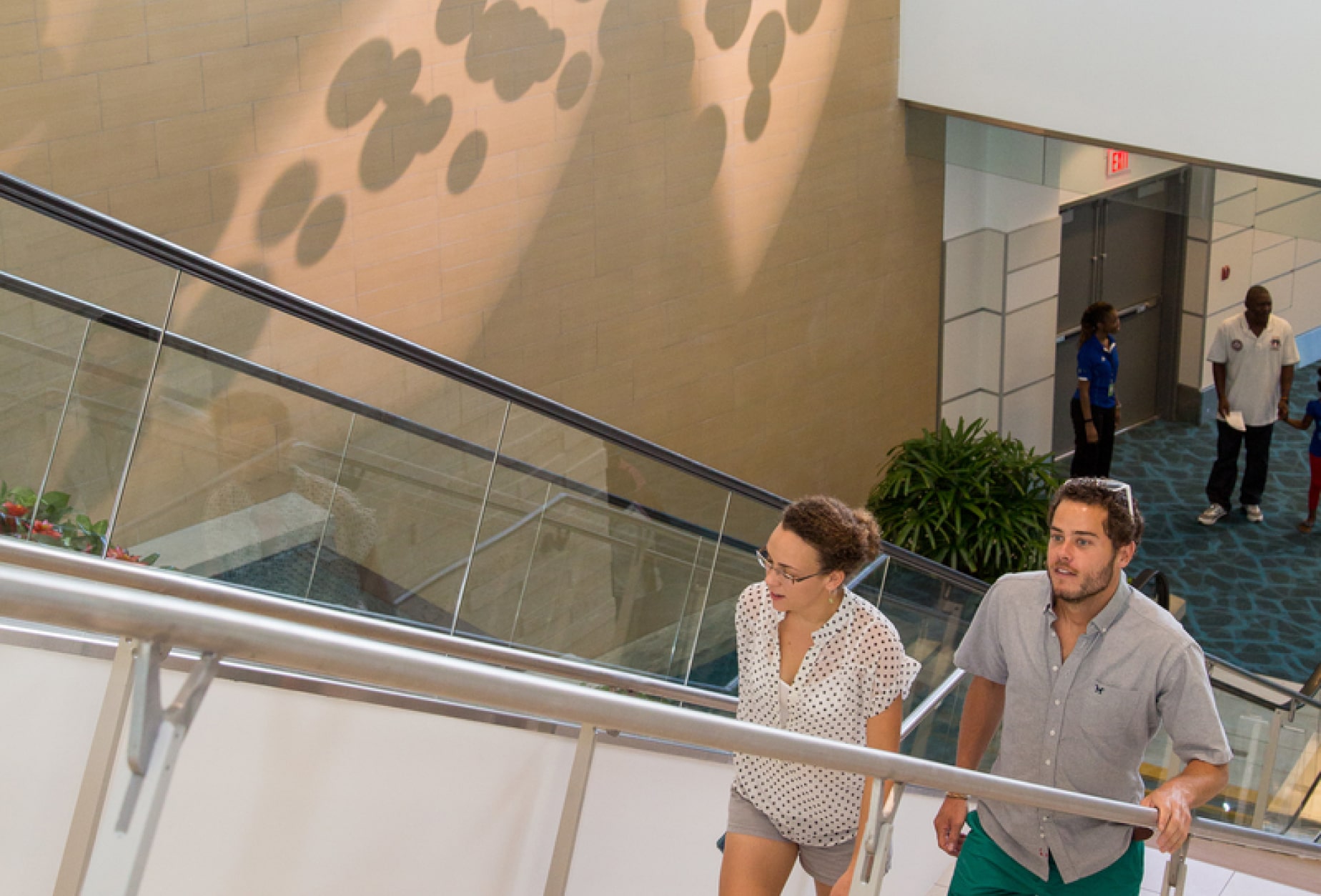 Tourists walking up the stairs at the airport